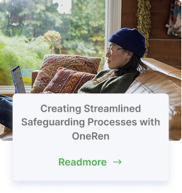 woman with glasses on couch with laptop